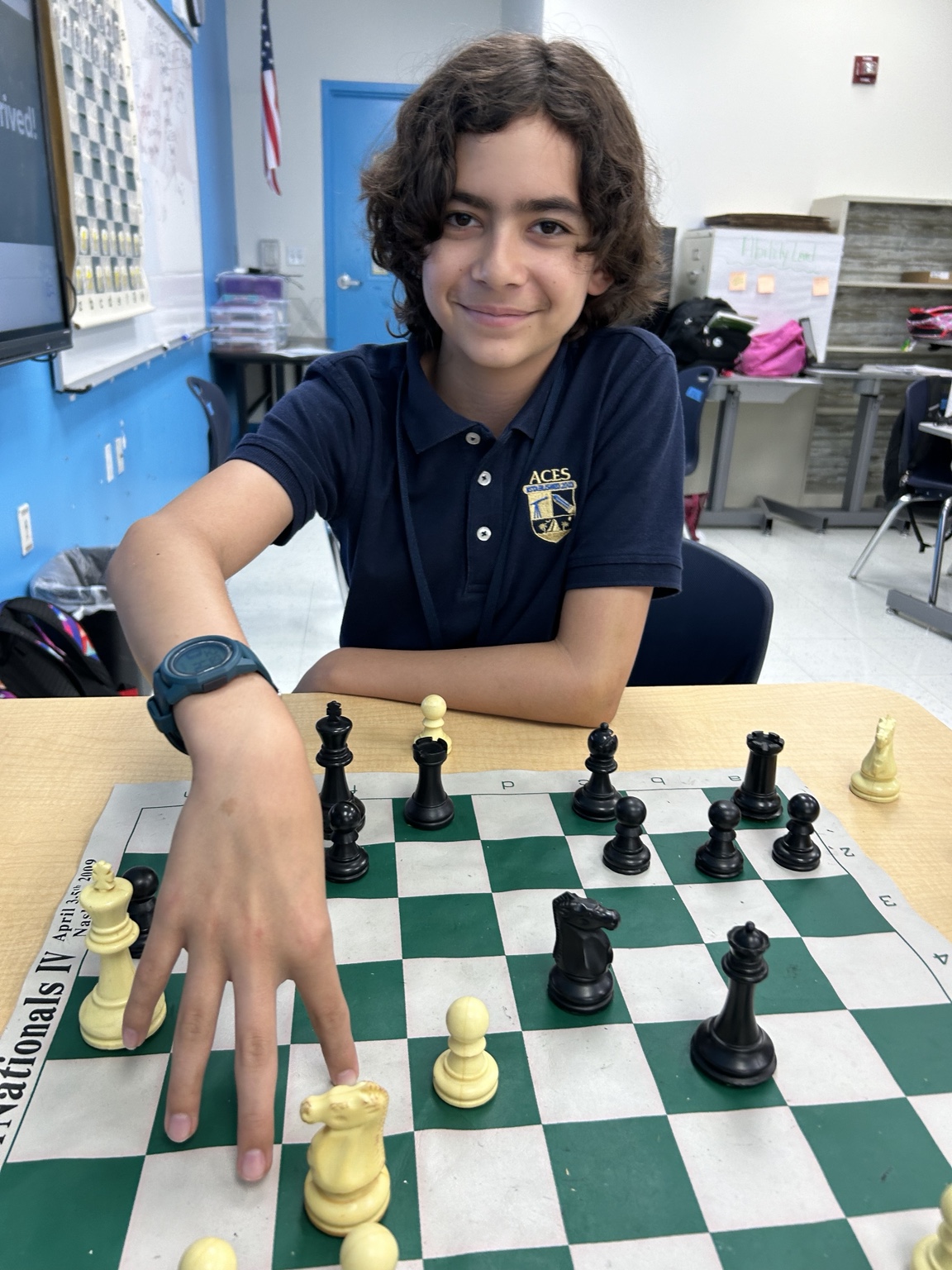 Student playing chess in class